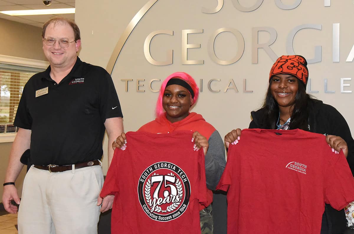 SGTC Aircraft Structural Instructor Jason Wisham is shown above with Iyonna Hall, a graduating senior from Macon County High School, and his graduate Makayla McCants, who is now excelling at the Warner Robins Air Force Base. McCants was the subject of Hall’s capstone project at Macon County High School.