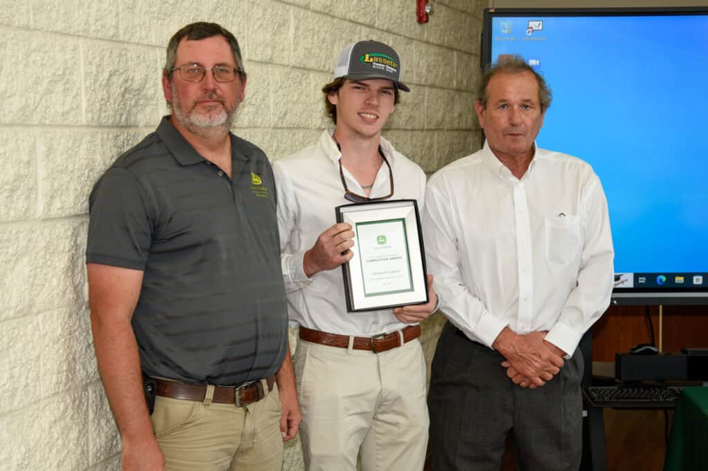 Student Cameron Purser receives plaque