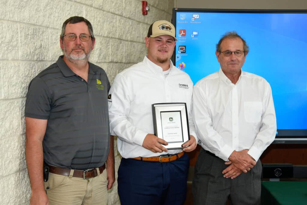 Student Hunter Knox receives plaque