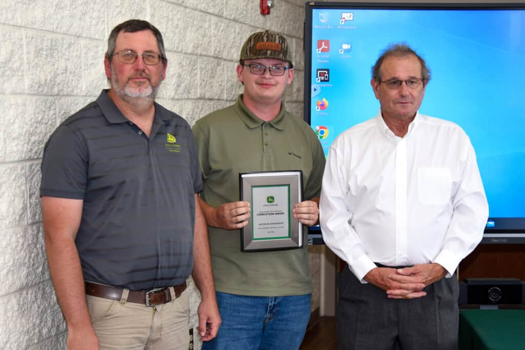 Student Jacob Blankenship receives plaque