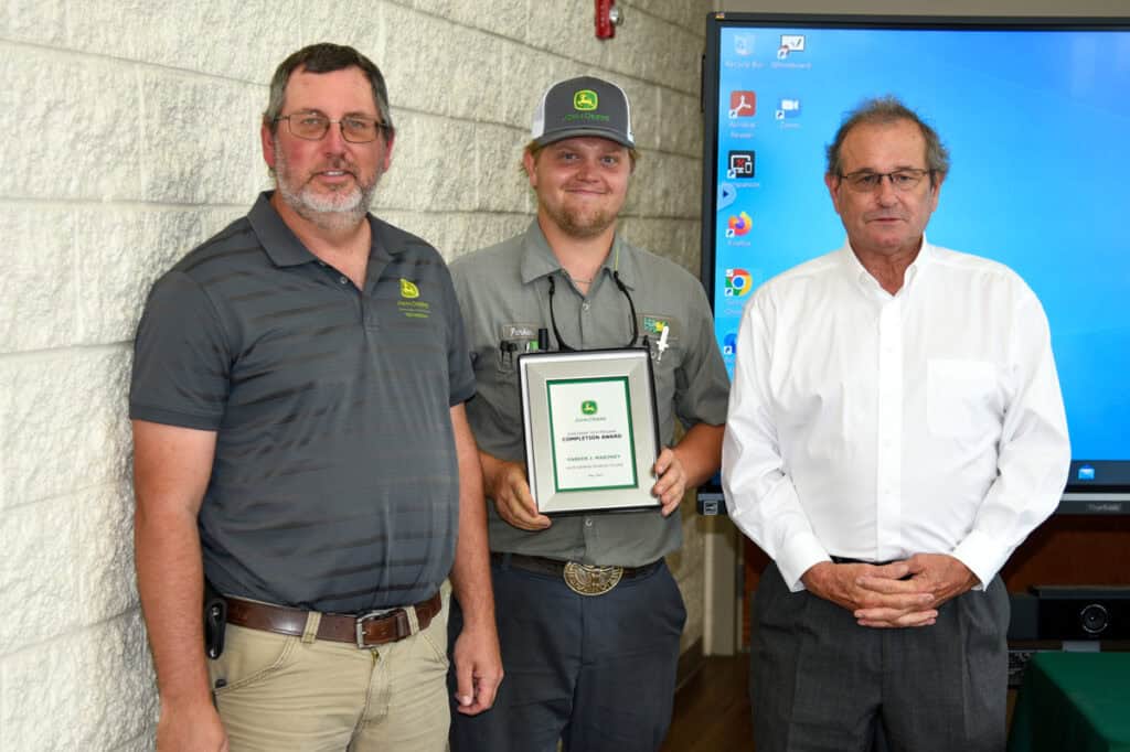 Student Parker Maroney receives plaque