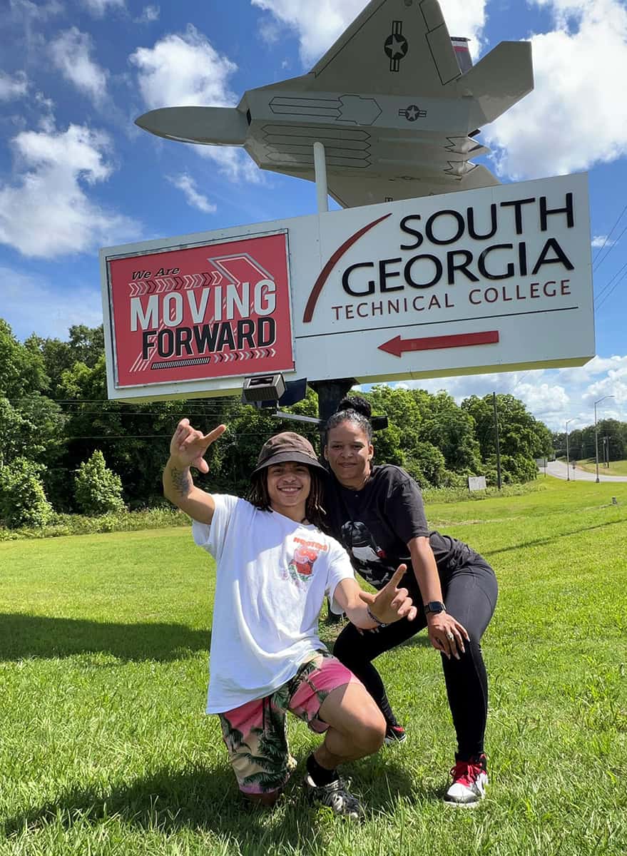 Jayden Slaughter is shown above with his aunt Simone Slaughter in front of the SGTC sign on South Georgia Technical College. His aunt posted on Instagram “May he always be moving forward.”