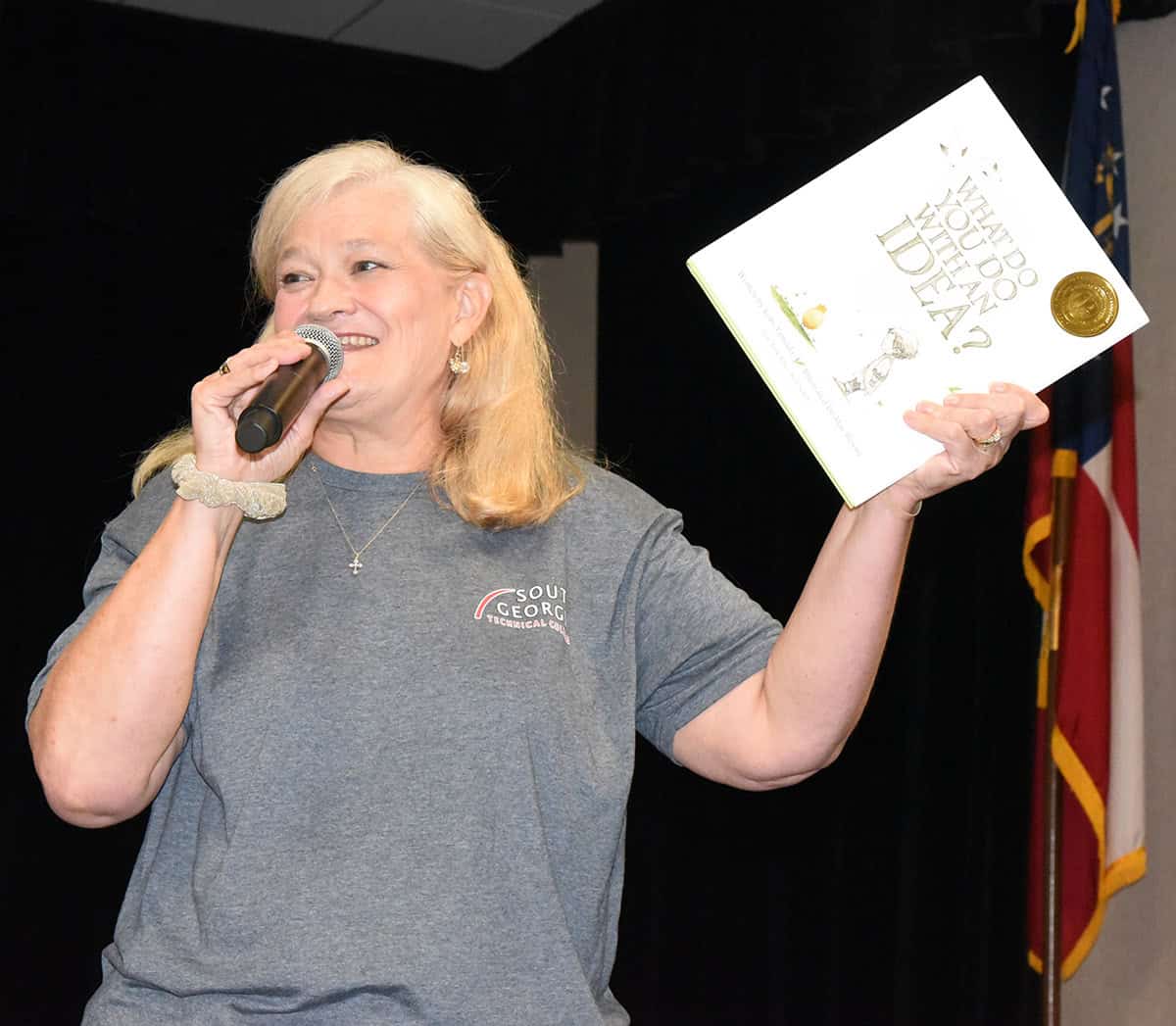 Heidi Gooden of Chattahoochee Flint RESA is shown above showing parents the book “What Do You Do With An Idea?” that each of the STEM campers received as part of participating in the week-long STEM camp at South Georgia Tech.