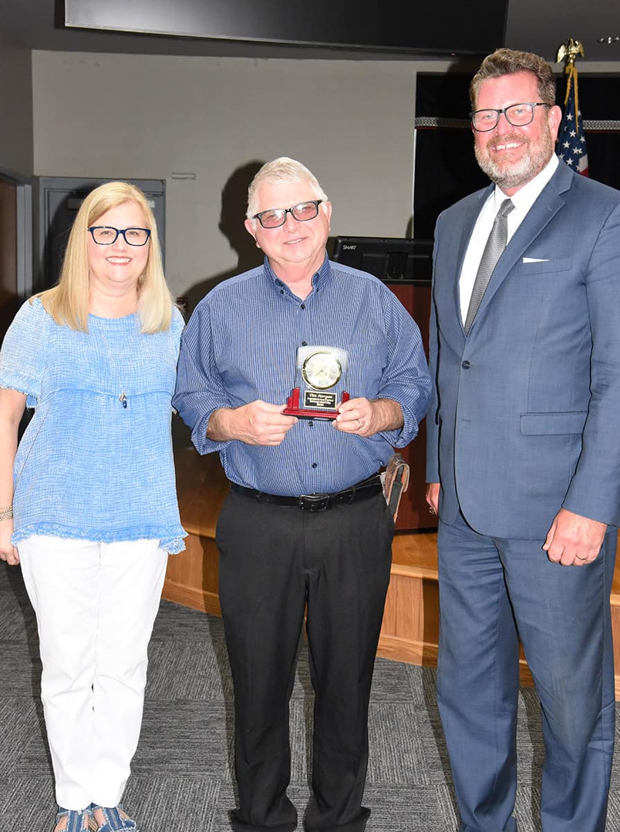 SGTC President Dr. John Watford and SGTC Assistant Vice President of Academic Affairs for the Crisp County Center Michelle McGowan are shown above presenting Morgan with his retirement clock/plaque.