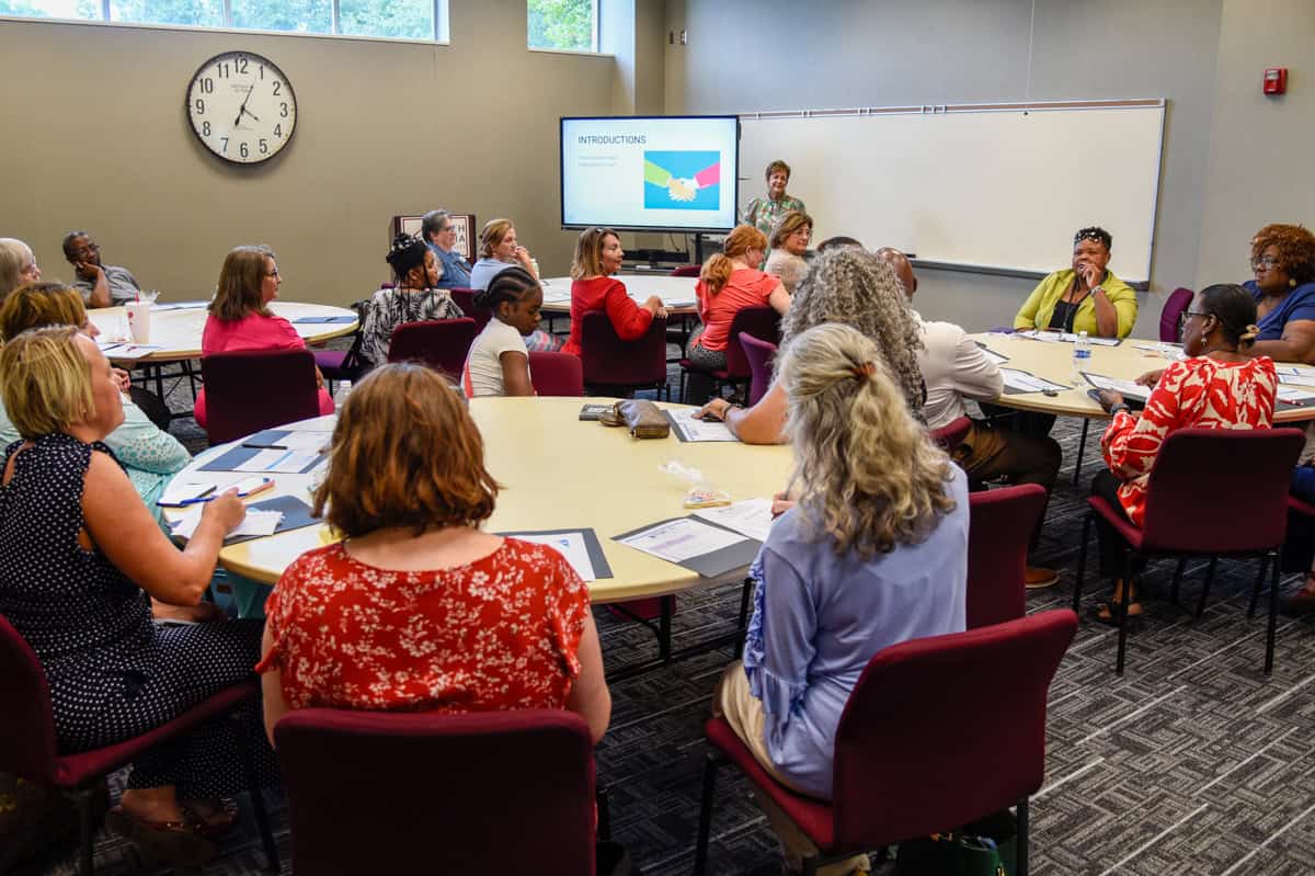 SGTC Dean of Adult Education Lillie Ann Winn (standing) speaks to members of the Adult Education advisory committee during a recent meeting on the Americus campus.