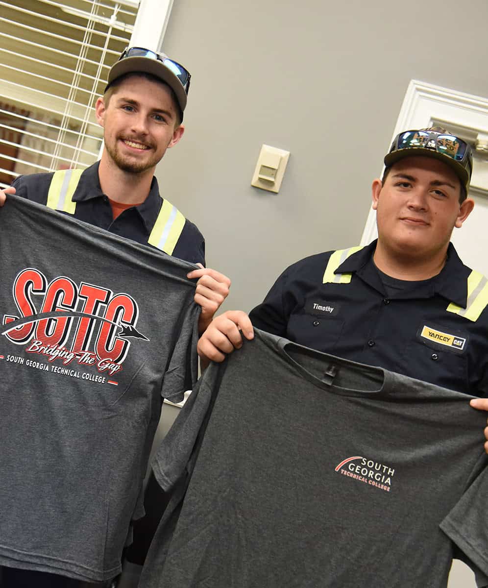 Shown above are SGTC Caterpillar students displaying the new “Bridging the Gap” free t-shirts available for students who register at South Georgia Tech this fall.
