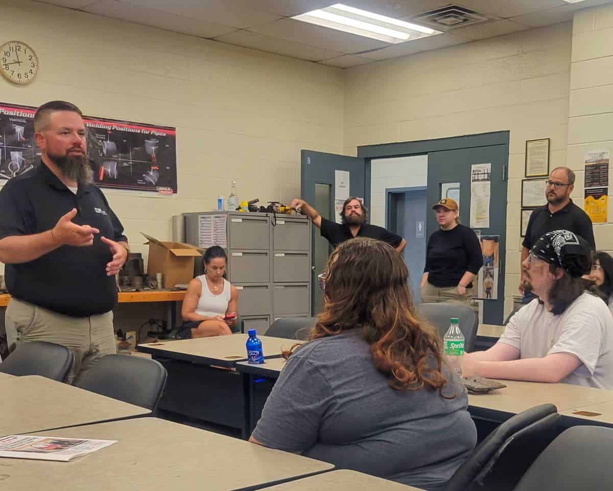 Marty D. Thompson of Ingalls Shipbuilding of Pascagoula, MS (left) speaks with welding students during a recent recruiting visit to the SGTC campus.