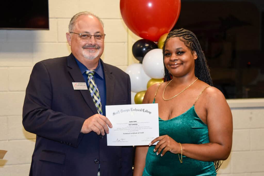 David Finley presents certificate to Jazlyn Grier