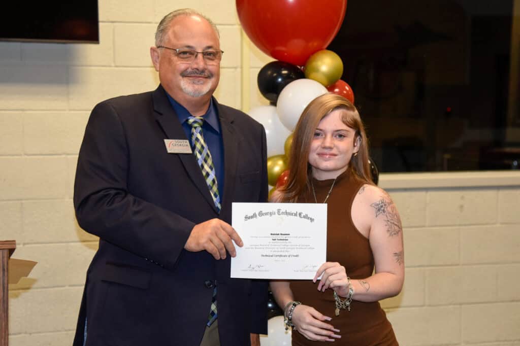 David Finley presents certificate to Maleiah Beamon