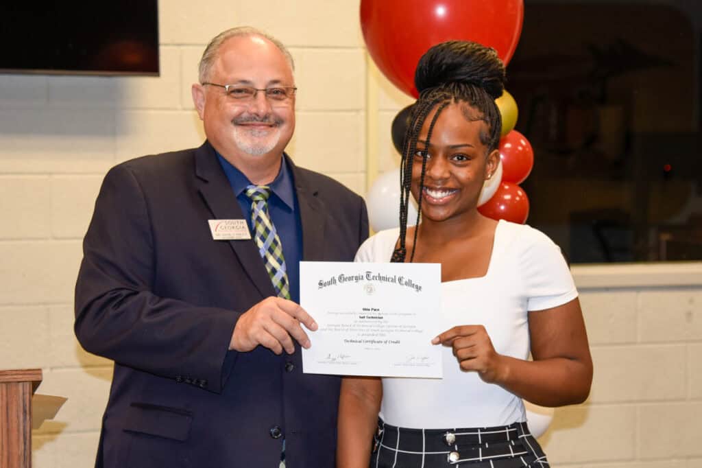 David Finley presents certificate to Shia Pace