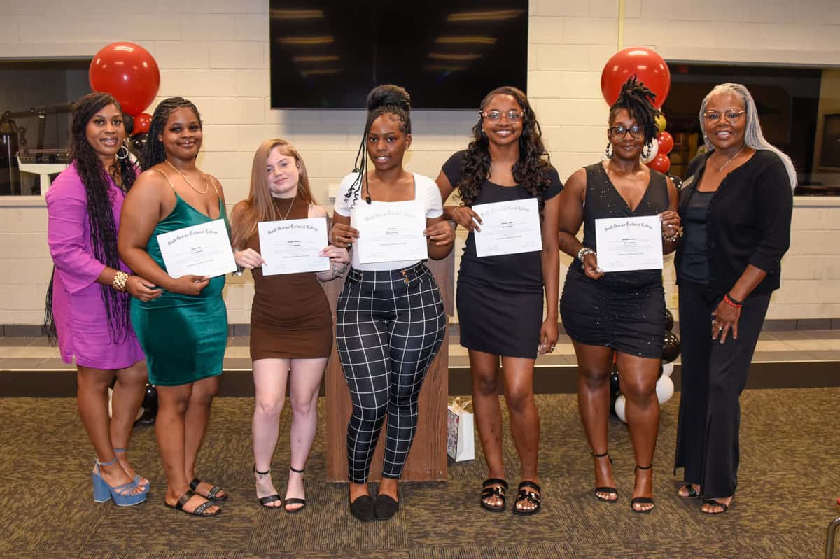 SGTC Nail Tech instructor Jessakeetha Maddox (left) and Cosmetology instructor Dorothea Lusane-McKenzie (right) are pictured here with recent graduates of the SGTC Nail Tech program.