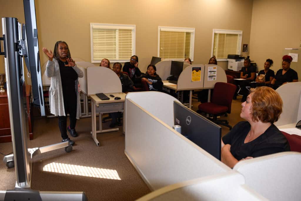 Jennifer Robinson (left) conducts a workshop for SGTC students on the topic of effective communication.