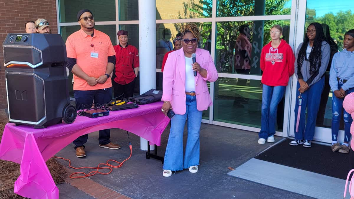 Breast Cancer survivor Terri Wooden speaks at the SGTC Crisp County Center for the college’s Breast Cancer Awareness Day.