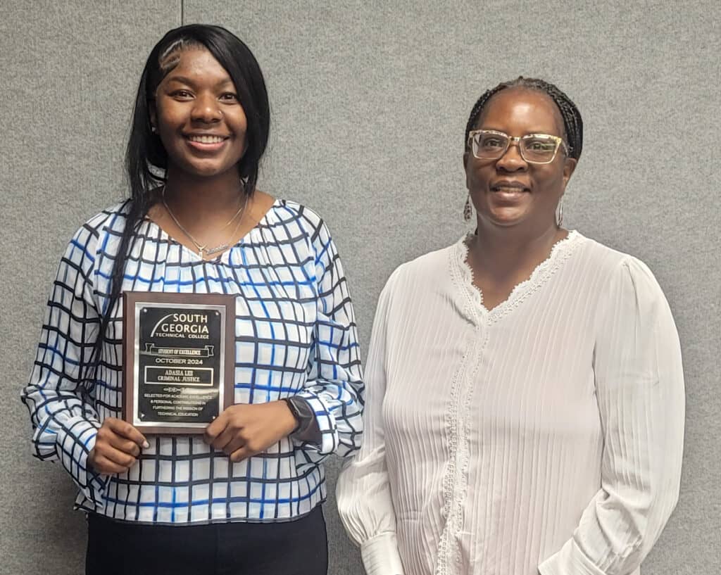 SGTC Crisp County Center Student of Excellence winner Adasia Lee (left) with Criminal Justice instructor Wanda Bishop.