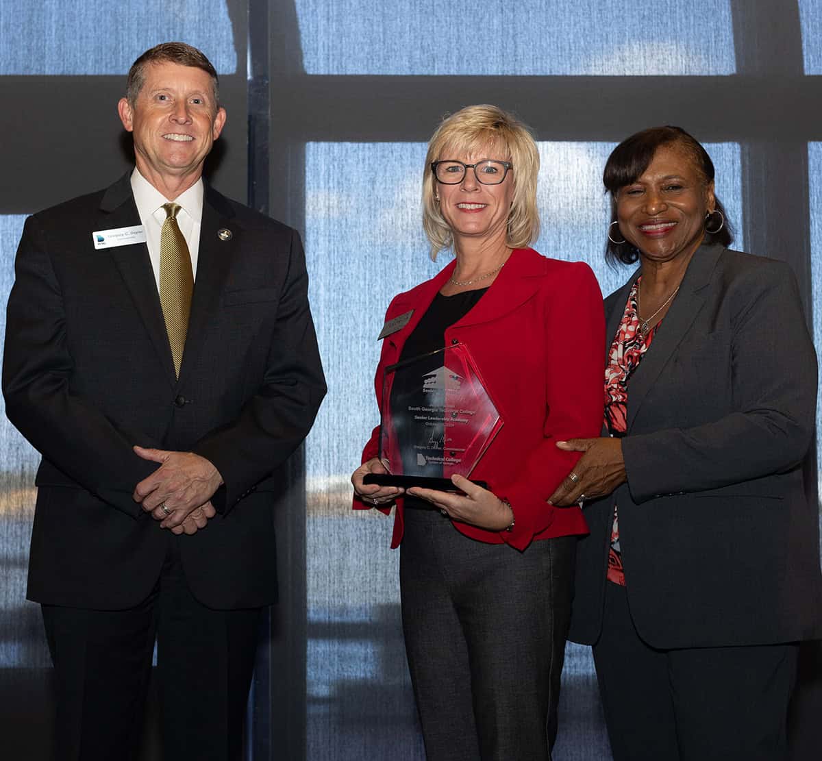 SGTC Vice President of Academic Affairs Julie Partain (center) is shown at the TCSG Leadership Academy Graduation ceremony with TCSG Commissioner Greg Dozier, and TCSG President Executive Leadership and Talent Initiatives Dr. Alvetta P. Thomas.