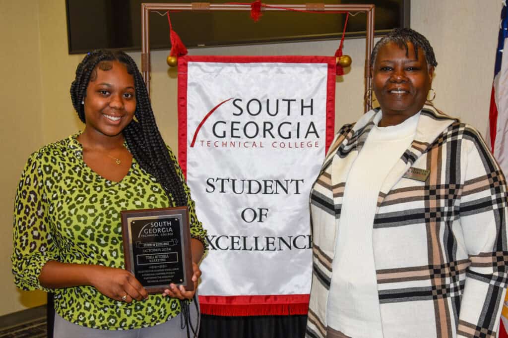 SGTC Student of Excellence winner Timia Mitchell (left) with Marketing Management instructor Mary Cross.