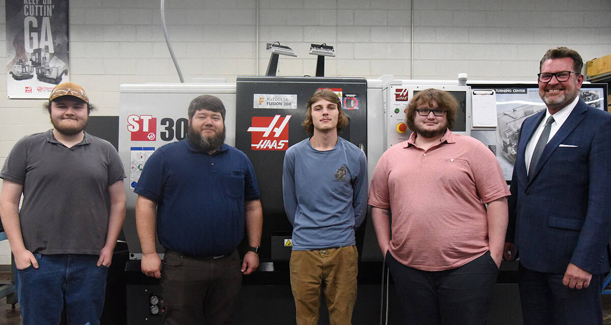 South Georgia Technical College President Dr. John Watford (right) is shown above with SGTC Precision Machining and Manufacturing Instructor Jake Pittman (second from left) and Gene Haas Scholarship winners Jordan Hayes, Alex Hobbs, and Blake Archer.