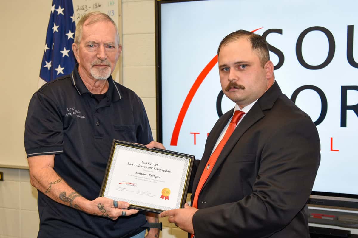 Matthew Rodgers of the South Georgia Technical College Law Enforcement Academy Class 24-01 is shown above with Lou Crouch receiving the SGTC Foundation’s Lou Crouch Law Enforcement Academy Scholarship award.