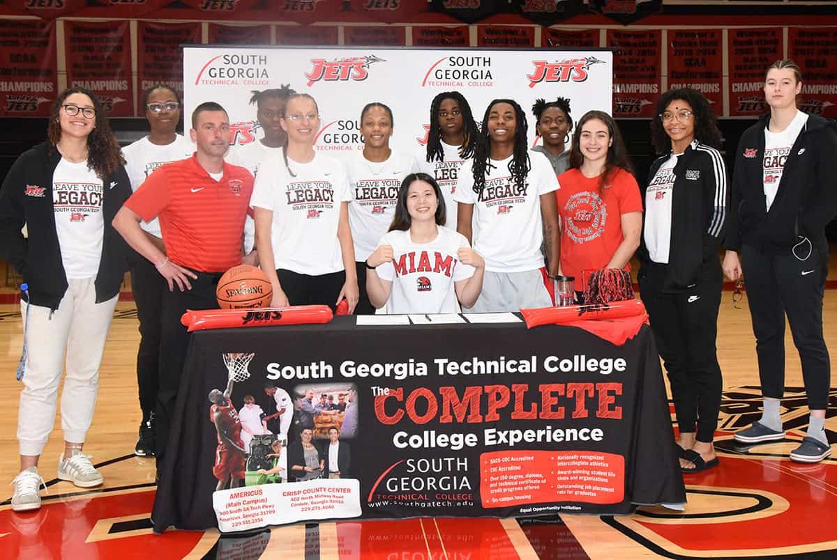 SGTC Mio Sakano is shown above inking her Letter of Intent to play basketball at the University of Miami for the 2025 – 2026 season. She is shown above with head coach Jason Carpenter and members of the 2024 – 2025 Lady Jets basketball team.