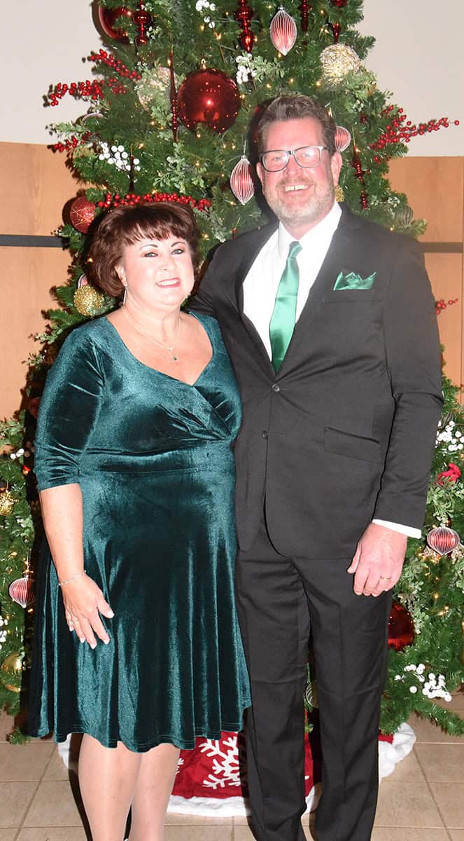 South Georgia Technical College President Dr. John Watford and his wife, Barbara, are shown above by one of the many Christmas trees decorating the John M. Pope Center.