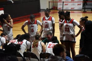 Lady Jets head coach Jason Carpenter is shown above talking with his team during a timeout.