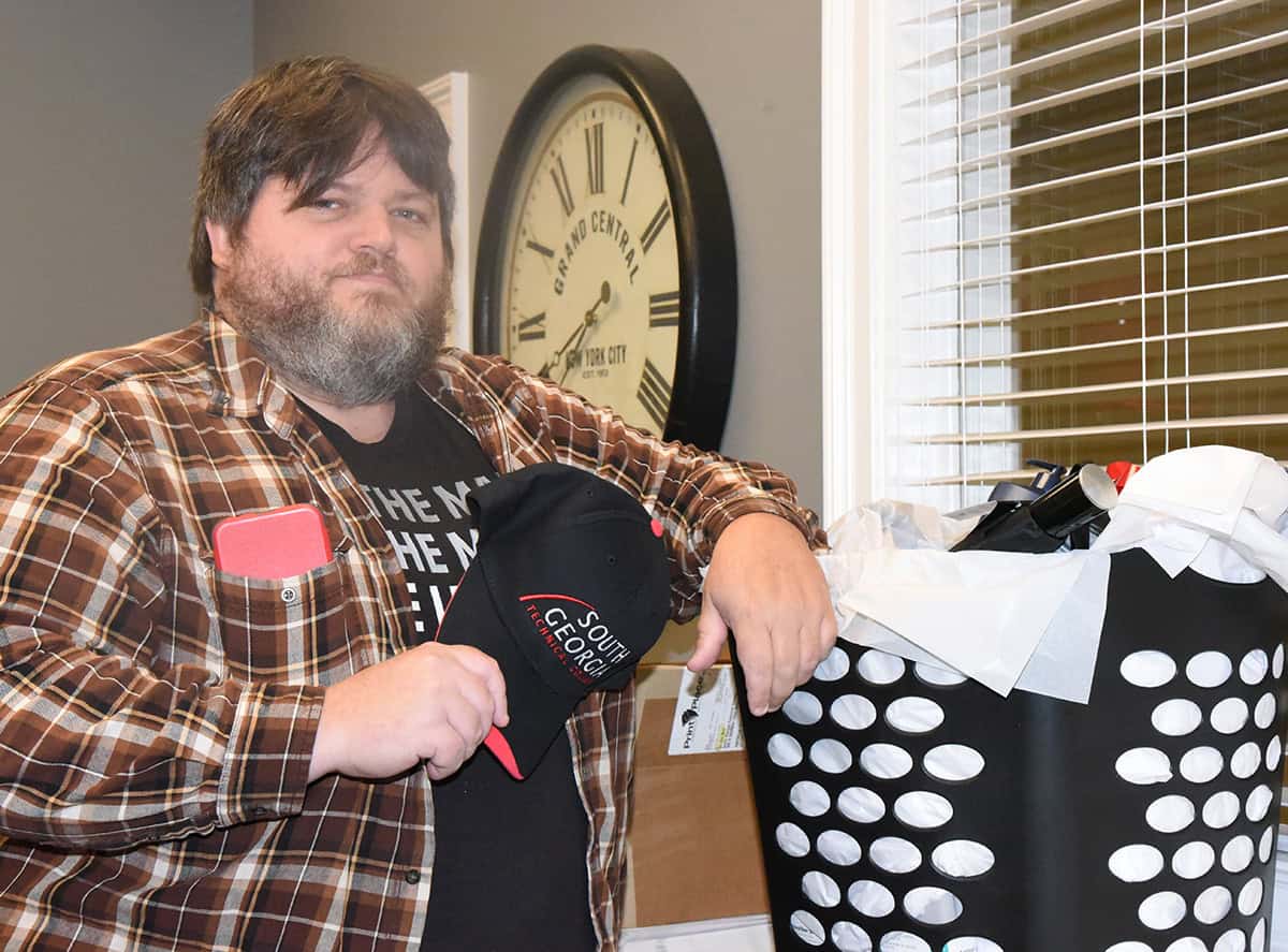 SGTC Medical Assisting student Joey Singletary is shown above with the large laundry basket he won for completing the QEP class.