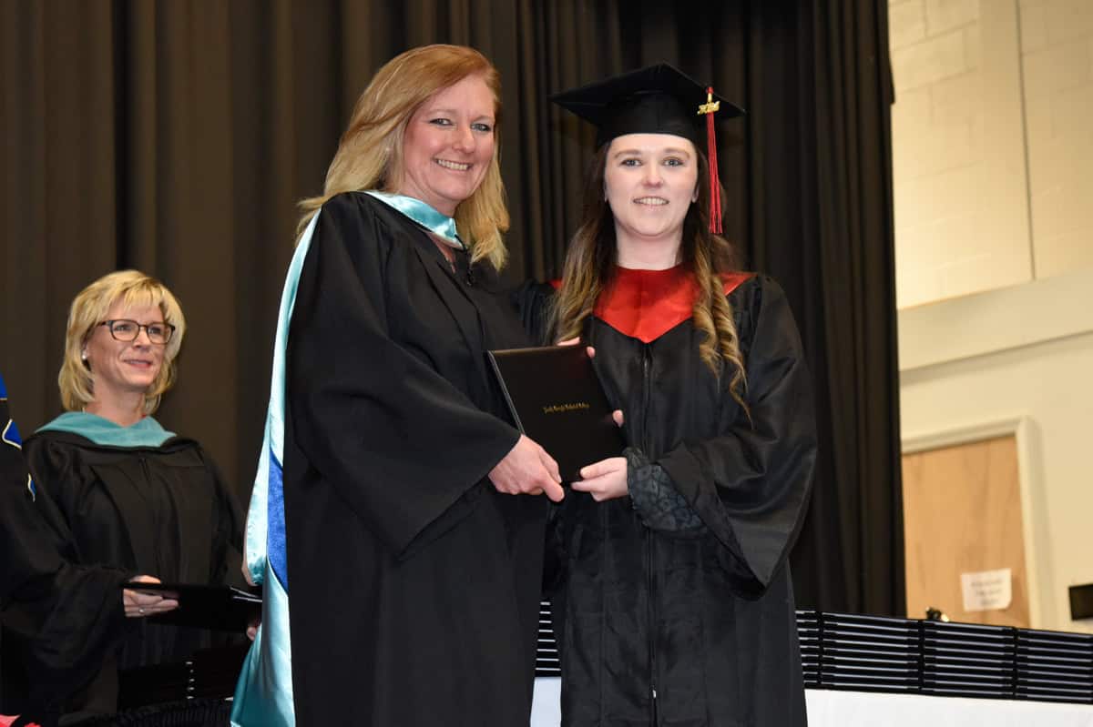 SGTC Human Resources Director Suzanne Singletary is shown above presenting her daughter, Ashton Singletary Tatum with her Associate of Applied Science degree in Allied Health Professions. Ashton was the first graduate of this new program. SGTC Vice President of Academic Affairs Julie Partain is shown in the background.