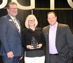 SGTC President Dr. John Watford is shown above congratulating Barbara Chestnut, SGTC's 2025 GOAL winner. GOAL Coordinator Josh Curtin is also shown.